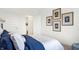 Bright bedroom with a comfortable bed and stylish wall art at 5904 Sunstone Rd, Indianapolis, IN 46239
