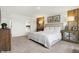 Main bedroom with wood accent wall and large bed at 5904 Sunstone Rd, Indianapolis, IN 46239