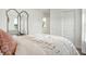 Bright bedroom with a large mirror and a white duvet at 5904 Sunstone Rd, Indianapolis, IN 46239