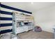 bedroom with bunk beds and blue accent wall at 5904 Sunstone Rd, Indianapolis, IN 46239