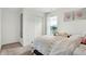 Bedroom with white sliding doors and a white duvet cover at 5904 Sunstone Rd, Indianapolis, IN 46239