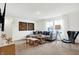Bright bonus room with sectional sofa and natural light from large windows at 5904 Sunstone Rd, Indianapolis, IN 46239