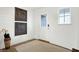 Bright entryway with wood floors, white walls, and decorative wall art at 5904 Sunstone Rd, Indianapolis, IN 46239