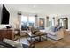 Bright living room with hardwood floors, large windows, and comfortable seating at 5904 Sunstone Rd, Indianapolis, IN 46239