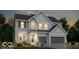 Two-story home with gray siding, stone accents, and a two-car garage at 6403 Rippling Rock Dr, Plainfield, IN 46168