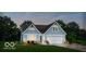 Craftsman style home with blue siding, white trim, and a two-car garage at 6434 Stone Side Dr, Plainfield, IN 46168