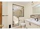 Bright bathroom with a tiled shower, modern vanity, and neutral color palette at 6826 E 65Th St, Indianapolis, IN 46220