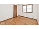 Cozy bedroom with hardwood floors and ample natural light from a double window at 6826 E 65Th St, Indianapolis, IN 46220