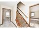 Bright entryway with neutral walls, tiled flooring, and a carpeted staircase at 6826 E 65Th St, Indianapolis, IN 46220