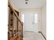 Bright entryway with neutral walls, tiled flooring, and a staircase at 6826 E 65Th St, Indianapolis, IN 46220