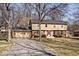 Charming two-story home with brick accents and a well-maintained front yard at 6826 E 65Th St, Indianapolis, IN 46220