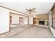 Spacious living room with new carpet, neutral walls and a stone fireplace at 6826 E 65Th St, Indianapolis, IN 46220