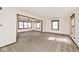 Spacious living room with new carpet, neutral walls and lots of windows at 6826 E 65Th St, Indianapolis, IN 46220