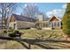 Expansive backyard with stone patio, outdoor seating, and lush lawn, perfect for entertaining and relaxing at 7837 Dean Rd, Indianapolis, IN 46240