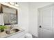 Well-lit bathroom featuring a modern sink, vanity, mirror, and a clean, functional design at 7837 Dean Rd, Indianapolis, IN 46240