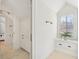 Bright bathroom with white cabinetry, and tiled floors, offering a clean and modern space at 7837 Dean Rd, Indianapolis, IN 46240