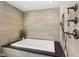 Bathroom showcases sleek tiled walls, a luxurious soaking tub, and stylish fixtures at 7837 Dean Rd, Indianapolis, IN 46240