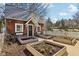 Quaint home exterior with lovely window boxes and landscaped garden beds, adding curb appeal and charm at 7837 Dean Rd, Indianapolis, IN 46240