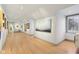 Long hallway serving as an art gallery, illuminated by track lighting, showcasing various artworks along the walls at 7837 Dean Rd, Indianapolis, IN 46240