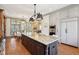 Open kitchen with large island, stainless steel appliances and an eat-in dining area at 7837 Dean Rd, Indianapolis, IN 46240