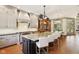 Modern kitchen with custom cabinets, a large island with seating, and sleek appliances at 7837 Dean Rd, Indianapolis, IN 46240