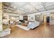 Expansive living area featuring a coffered ceiling, wet bar, and a cozy seating arrangement at 7837 Dean Rd, Indianapolis, IN 46240