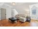 Comfortable living room with a gray sectional couch, hardwood floors, and a modern coffee table at 7837 Dean Rd, Indianapolis, IN 46240