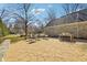 Spacious stone patio with outdoor dining and seating areas, ideal for enjoying outdoor meals and gatherings at 7837 Dean Rd, Indianapolis, IN 46240