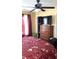 Bedroom with a queen bed, dresser, and a large TV at 917 E 34Th St, Indianapolis, IN 46205