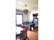Bright dining room with hardwood floors, wood table and chairs, and a chandelier at 917 E 34Th St, Indianapolis, IN 46205