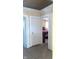 Hallway with carpet, doors to bedrooms, and neutral walls at 917 E 34Th St, Indianapolis, IN 46205