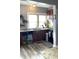 Kitchen features granite countertops, wood cabinets, and a double sink at 917 E 34Th St, Indianapolis, IN 46205