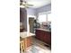 Kitchen with granite island, wood cabinets, and a ceiling fan at 917 E 34Th St, Indianapolis, IN 46205