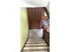 Wooden staircase leading to the upper level of the home at 917 E 34Th St, Indianapolis, IN 46205