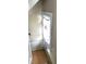 Small upper level room with wood floors and window at 917 E 34Th St, Indianapolis, IN 46205