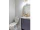Stylish powder room with a modern vanity and gold fixtures at 10138 Catalina Dr, Indianapolis, IN 46235