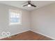 Well-lit bedroom with hardwood floors and a window at 10138 Catalina Dr, Indianapolis, IN 46235