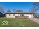 Ranch style home with attached garage and well-manicured lawn at 10138 Catalina Dr, Indianapolis, IN 46235