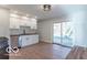 Modern kitchen with white cabinets, stainless steel appliances, and wood flooring at 10138 Catalina Dr, Indianapolis, IN 46235