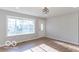 Bright living room featuring hardwood floors and large windows at 10138 Catalina Dr, Indianapolis, IN 46235