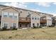 Back view of Townhomes with wooden decks overlooking backyard at 11436 Mossy Ct # 102, Fishers, IN 46037