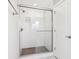 Modern bathroom with a glass shower enclosure and white tile at 11436 Mossy Ct # 102, Fishers, IN 46037
