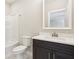 Modern bathroom with dark vanity, white countertop, and a shower/tub combo at 11436 Mossy Ct # 102, Fishers, IN 46037