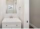 Small bathroom with white vanity, single sink, and framed mirror at 11436 Mossy Ct # 102, Fishers, IN 46037