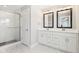 En suite bathroom with double vanity, marble flooring, and walk-in shower at 11436 Mossy Ct # 102, Fishers, IN 46037