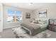 Comfortable bedroom with soft neutral colors, a plush bed, and decorative artwork for a relaxing retreat at 11436 Mossy Ct # 102, Fishers, IN 46037