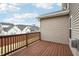 A lovely outdoor space with wooden deck overlooking houses and blue sky at 11436 Mossy Ct # 102, Fishers, IN 46037