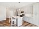 Modern kitchen with gray cabinets, quartz countertops, and island at 11436 Mossy Ct # 102, Fishers, IN 46037