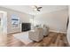 Living room with fireplace, hardwood floors, and neutral decor at 11436 Mossy Ct # 102, Fishers, IN 46037