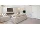 Open-concept living room with comfortable seating, sleek entertainment center, and minimalist design at 11436 Mossy Ct # 102, Fishers, IN 46037